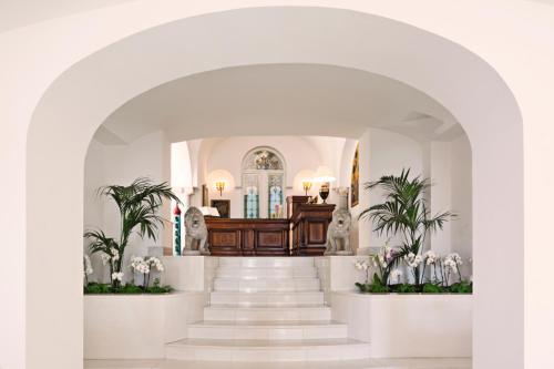 a church with a staircase leading to a church altar at Palazzo Avino in Ravello