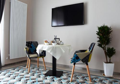 TV a/nebo společenská místnost v ubytování Casa Isabela luxury rooms