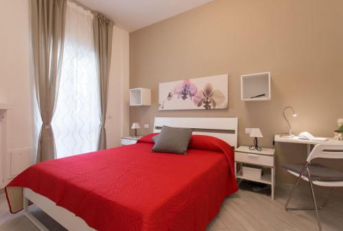 Ein Bett oder Betten in einem Zimmer der Unterkunft Ottoboni Apartment, 4 persone, balcone, Wi-Fi, Stazione Tiburtina