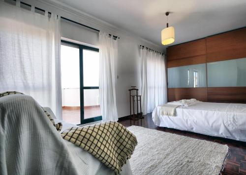 Postel nebo postele na pokoji v ubytování Amadora Terrace View