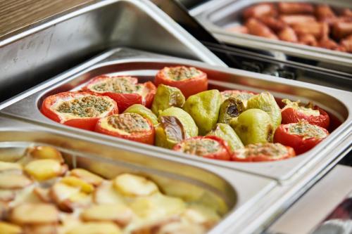 a tray of food with tomatoes and other vegetables at NOBEL Hotel in Baku