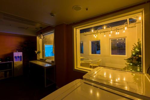 a dining room with a table and a window at MJ Stay 2 in Seoul