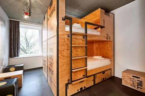 a small room with bunk beds in it at H.ostel Münster in Münster