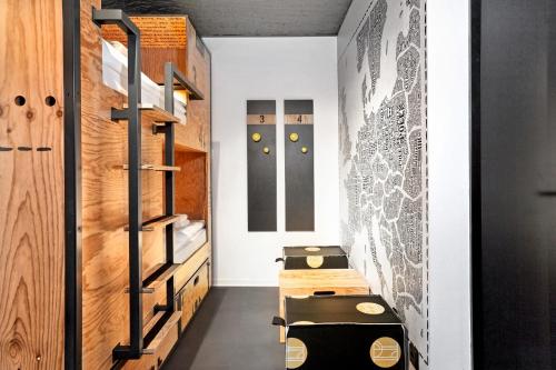a room with black and white walls and a staircase at H.ostel Münster in Münster