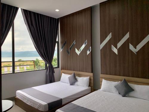Giường trong phòng chung tại Homestay Thien Trang Sea View