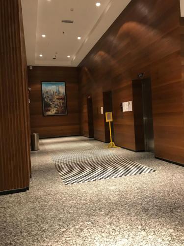 a hallway of a building with wooden walls at Rumah Cik Ani in Shah Alam