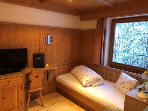 TV a/nebo společenská místnost v ubytování Hotel Garni Bergwelt