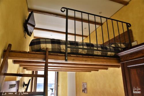 a bunk bed in a room with a window at La Casa di Nonna in Tivoli
