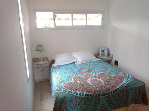 A bed or beds in a room at Casacubo Necochea