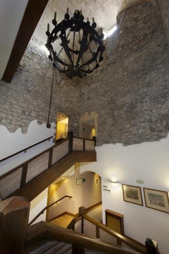 a chandelier hangs from the ceiling of a building at Parador de Hondarribia in Hondarribia