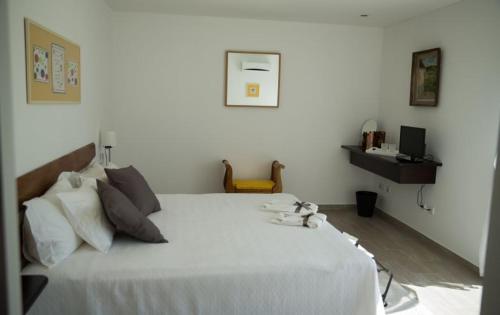 Ένα ή περισσότερα κρεβάτια σε δωμάτιο στο Casa dos Becos
