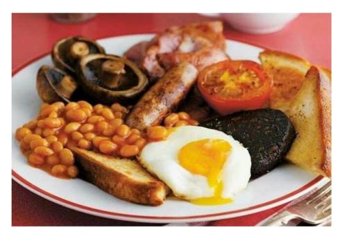 a plate of breakfast food with eggs beans and toast at The Blue Mantle in Wellington