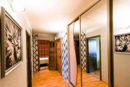 a hallway of a house with a mirror at Квартира на Октябрьской 39 in Salihorsk