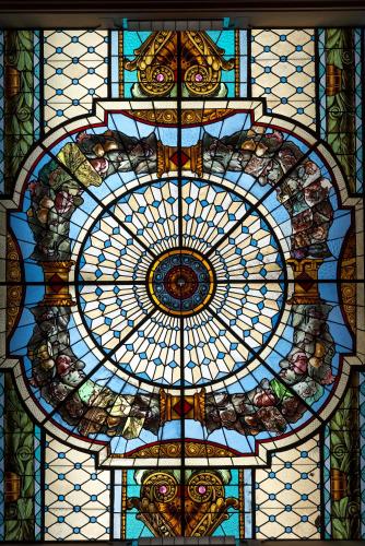 a large stained glass window with a depiction of a flower at Sofitel Montevideo Casino Carrasco & Spa in Montevideo