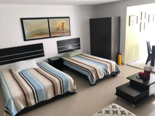 Ένα ή περισσότερα κρεβάτια σε δωμάτιο στο Villa San Miguel