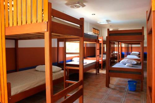 a group of bunk beds in a room at Hacienda bambú in Bacalar