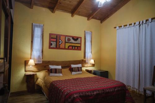 A bed or beds in a room at Posada Vientos de Belgrano