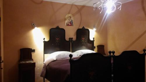 Postel nebo postele na pokoji v ubytování Agriturismo il Bacucco