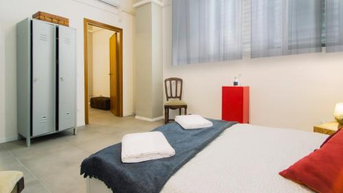 Postel nebo postele na pokoji v ubytování Hostelleria