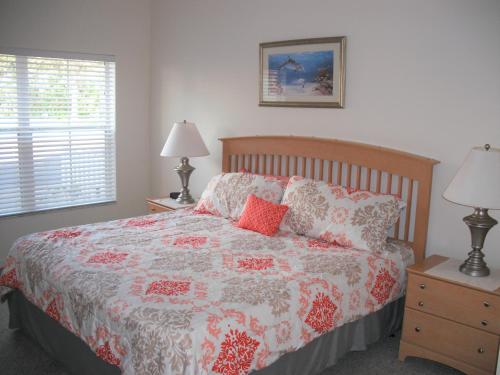 A bed or beds in a room at Venetian Bay Villa 4 Bedroom Townhouse - Near Disney