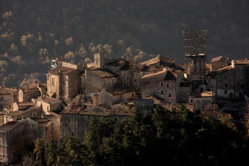 a group of buildings on top of a mountain at Residenza La Torre in Santo Stefano di Sessanio