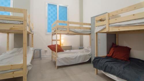Postel nebo postele na pokoji v ubytování Hostelleria