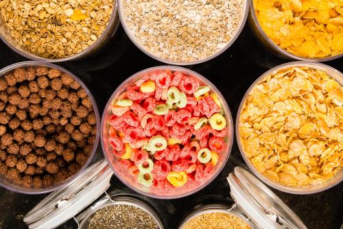 a group of bowls filled with different types of food at Hotel Campo Largo Express in Campo Largo