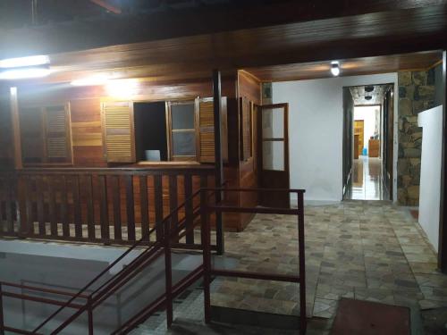 a room with a staircase in a house at Domus Guesthouse in Santana