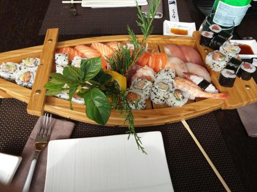 a tray of sushi and seafood on a table at B&B Nazareth in Barletta