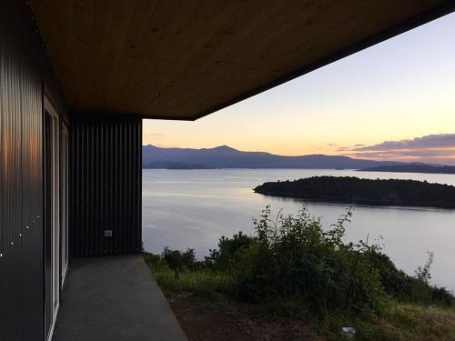 a view of a lake from a house at Casa La Trafa in Futrono