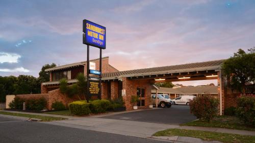 a gas station with a sign in front of it at Sandhurst Motor Inn Bendigo in Bendigo