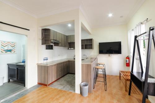 a kitchen with a counter and a bar in a room at Mario Dive Resort in Panglao