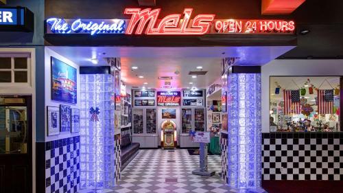 a mall entrance with a neon sign in a store at Best Western Plus Boomtown Casino Hotel in Reno