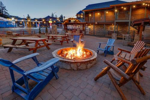 a fire pit in a patio with chairs and tables at Hotel Becket, BW Signature Collection in South Lake Tahoe