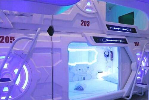 an inside view of a hospital room with a bed at Hotel Shakti Capsule in Bandung