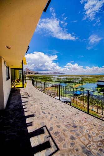 a view of the river from the balcony of a building at Yacht Lago Titicaca in Ichu