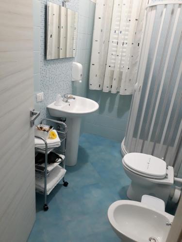 a bathroom with a toilet and a sink at A casa di Simona in Monreale