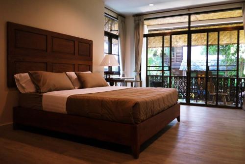 Postel nebo postele na pokoji v ubytování Mountain View GuesthouseChiangmai