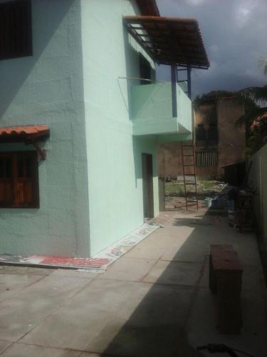 a building with a staircase on the side of it at Costa Brasil in Coroa Vermelha