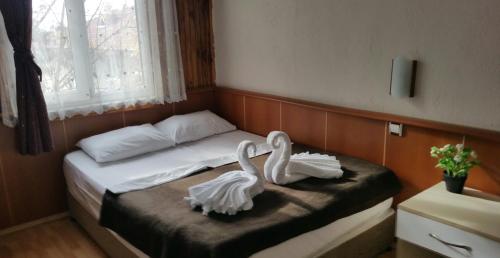 Postel nebo postele na pokoji v ubytování Mustafa Hotel