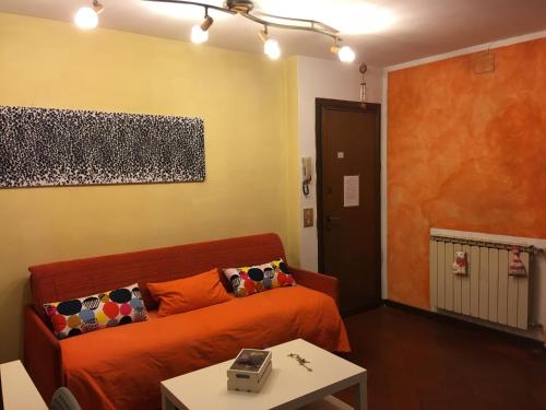 a living room with a couch and a table at Boccaccio Apartment in Sesto Fiorentino