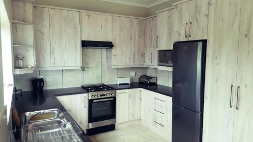 Kuchyň nebo kuchyňský kout v ubytování Knysna Paradise Guesthouse