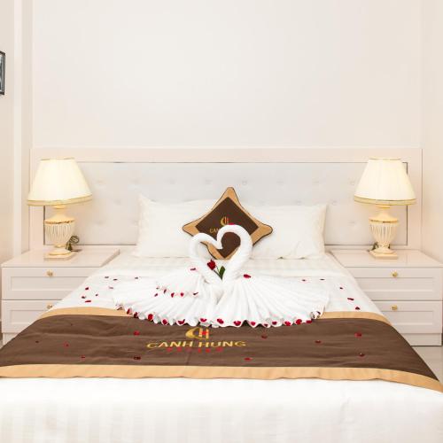 a bed with a swan decoration on it at Canh Hung Palace in Hai Phong