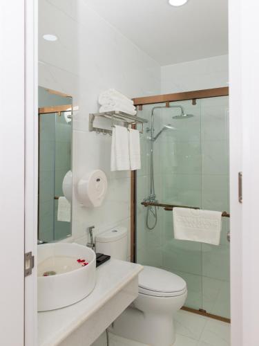 a bathroom with a sink and a toilet and a shower at Canh Hung Palace in Hai Phong