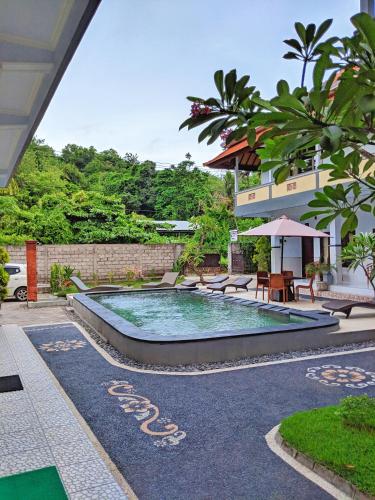 Serangan Inn Mimbaの敷地内または近くにあるプール