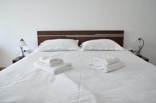 Llit o llits en una habitació de Alexys Residence 5