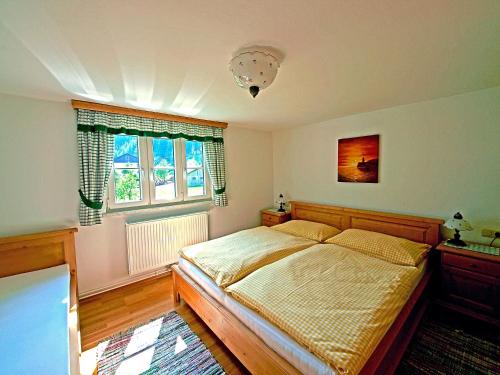Tempat tidur dalam kamar di Ferienhaus Eva Deufl