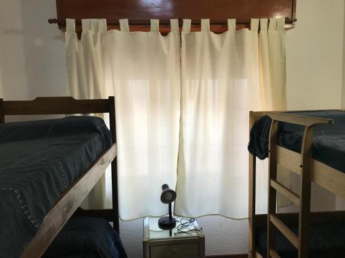 Postel nebo postele na pokoji v ubytování DUPLEX La Lucila del Mar