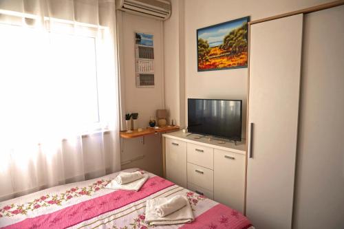 מיטה או מיטות בחדר ב-Apartment Umag Nelly