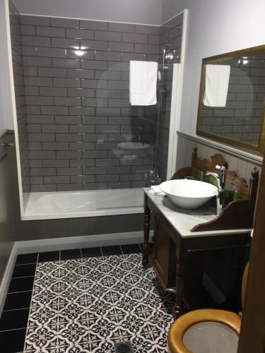 a bathroom with a sink and a shower at Left Bank in Kaikohe